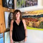 Judy in front of her pieces